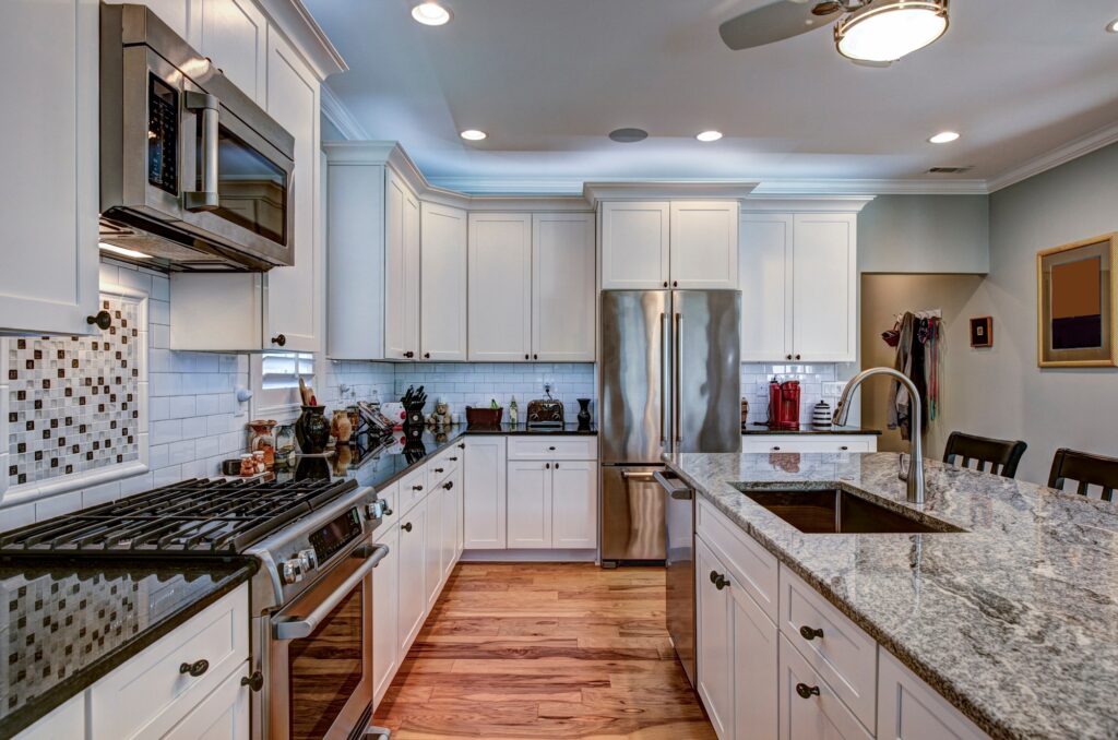 High-end luxury kitchen with granite countertops and white cabin
